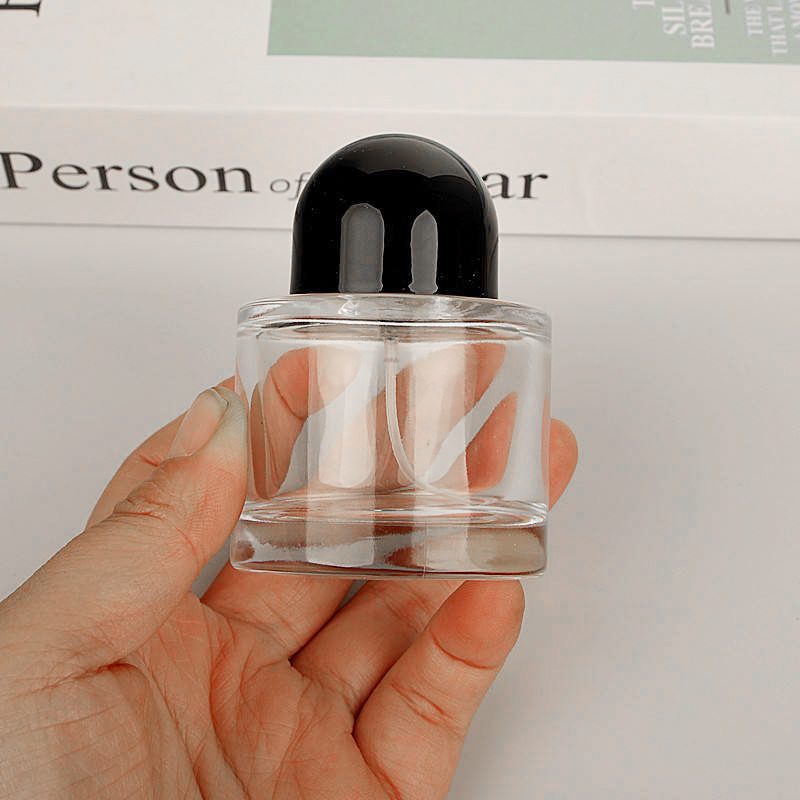 Cosmetic Packaging Luxury 50ml Empty Clear Round Cylinder Perfume Spray Glass Bottle With Black Cap