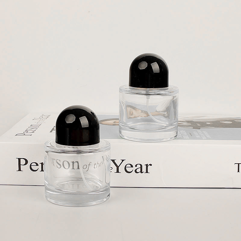 Cosmetic Packaging Luxury 50ml Empty Clear Round Cylinder Perfume Spray Glass Bottle With Black Cap