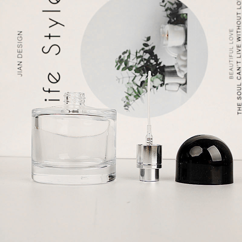 Cosmetic Packaging Luxury 50ml Empty Clear Round Cylinder Perfume Spray Glass Bottle With Black Cap