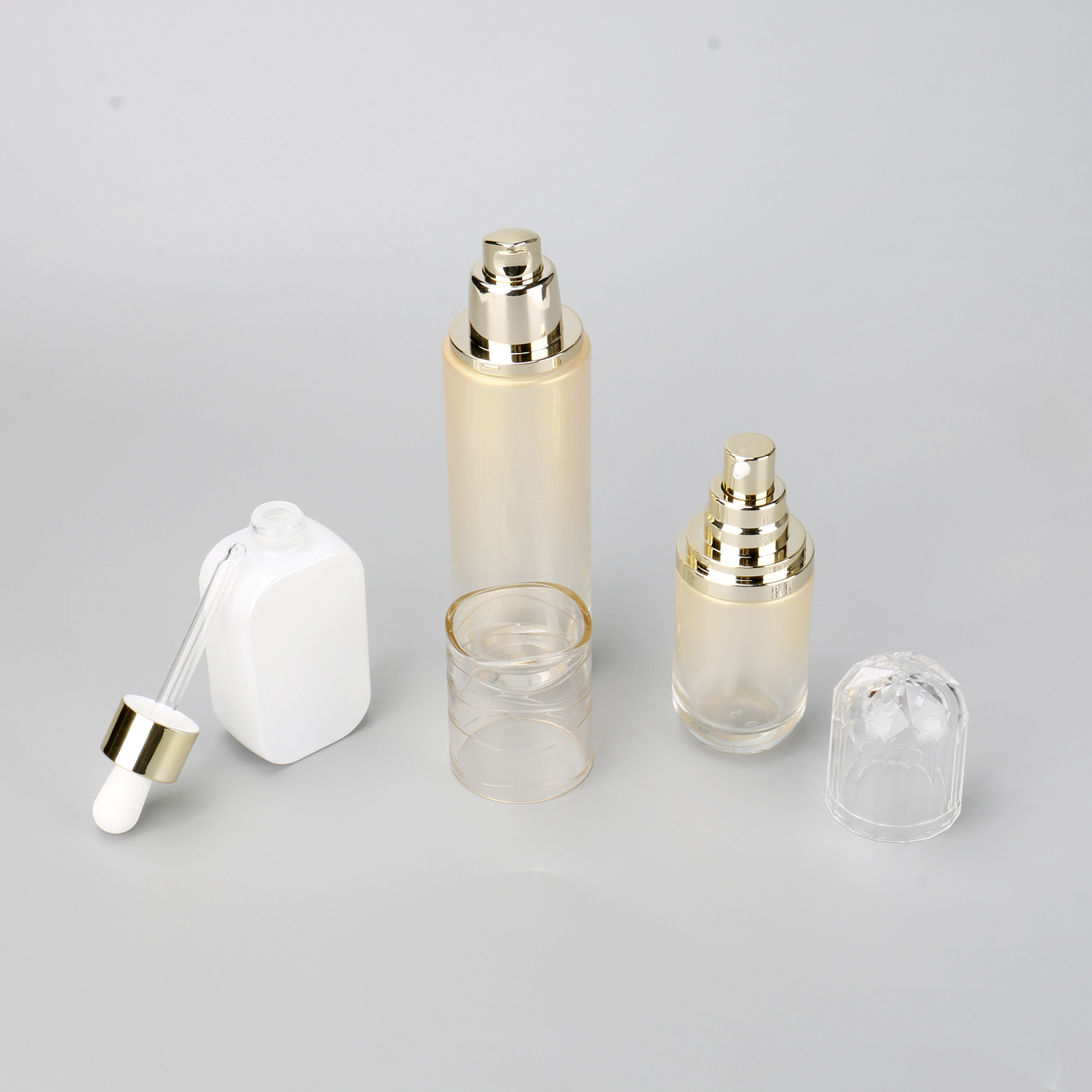 Luxury Skincare Serum Bottle Gold 40ml 100ml Cosmetic Glass Essential Oil Bottle With Dropper And Pump