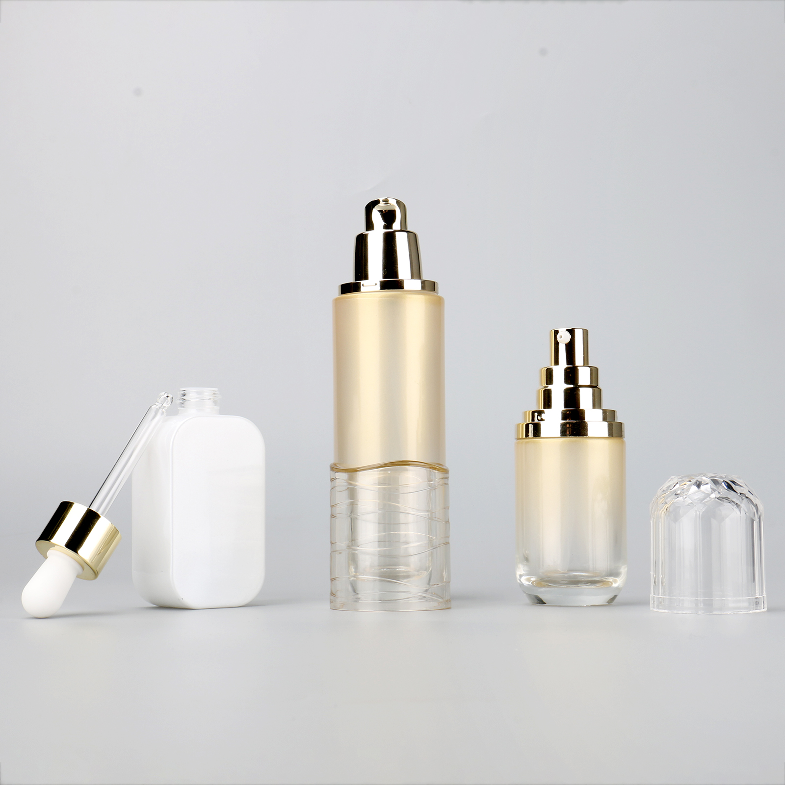 Luxury Skincare Serum Bottle Gold 40ml 100ml Cosmetic Glass Essential Oil Bottle With Dropper And Pump