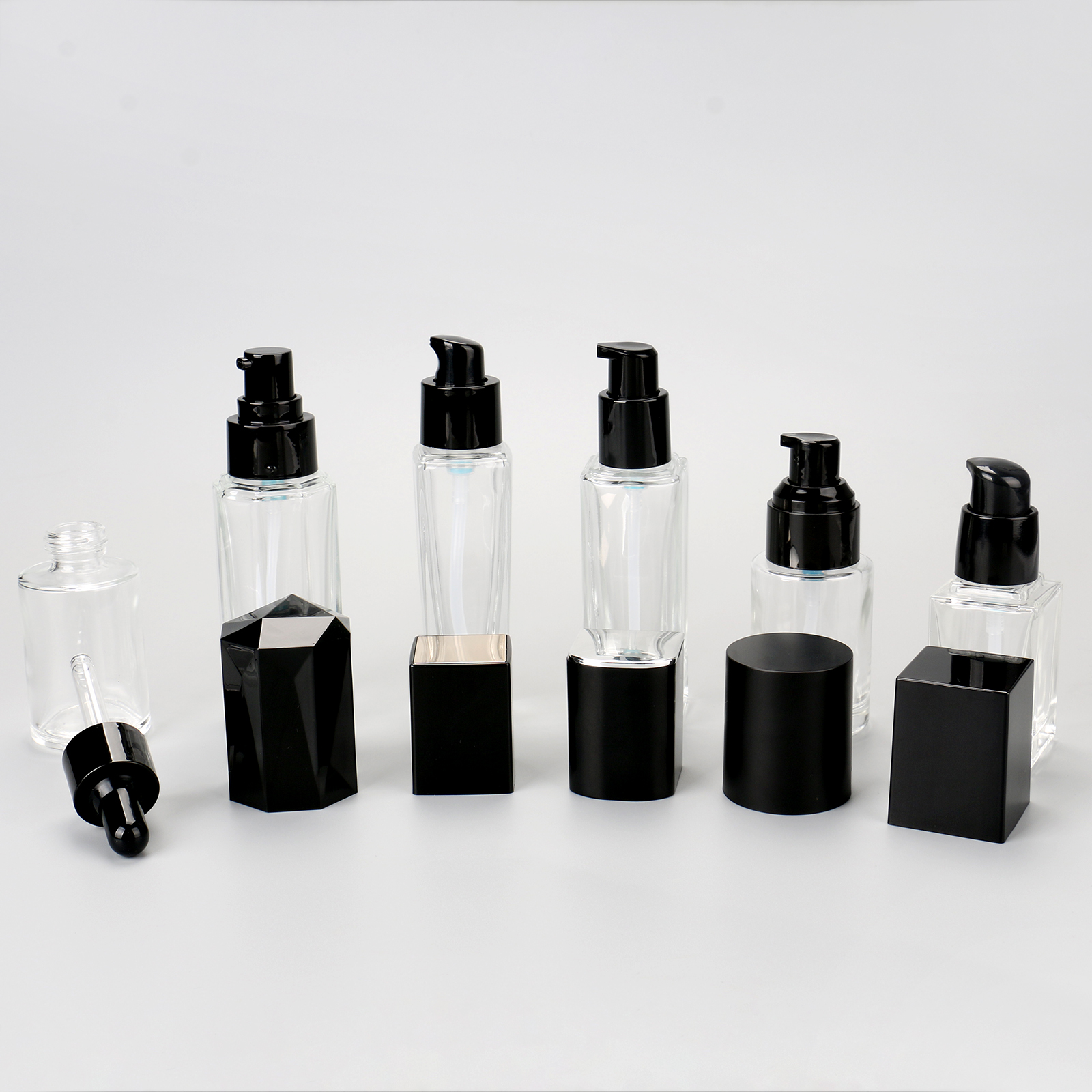 Cosmetic Packaging Container Empty Skincare Set Bottle Transparent Glass Lotion Serum Pump Bottle With Black Lid