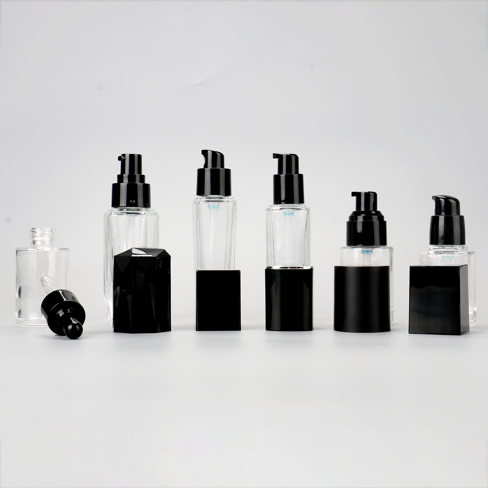 Cosmetic Packaging Container Empty Skincare Set Bottle Transparent Glass Lotion Serum Pump Bottle With Black Lid