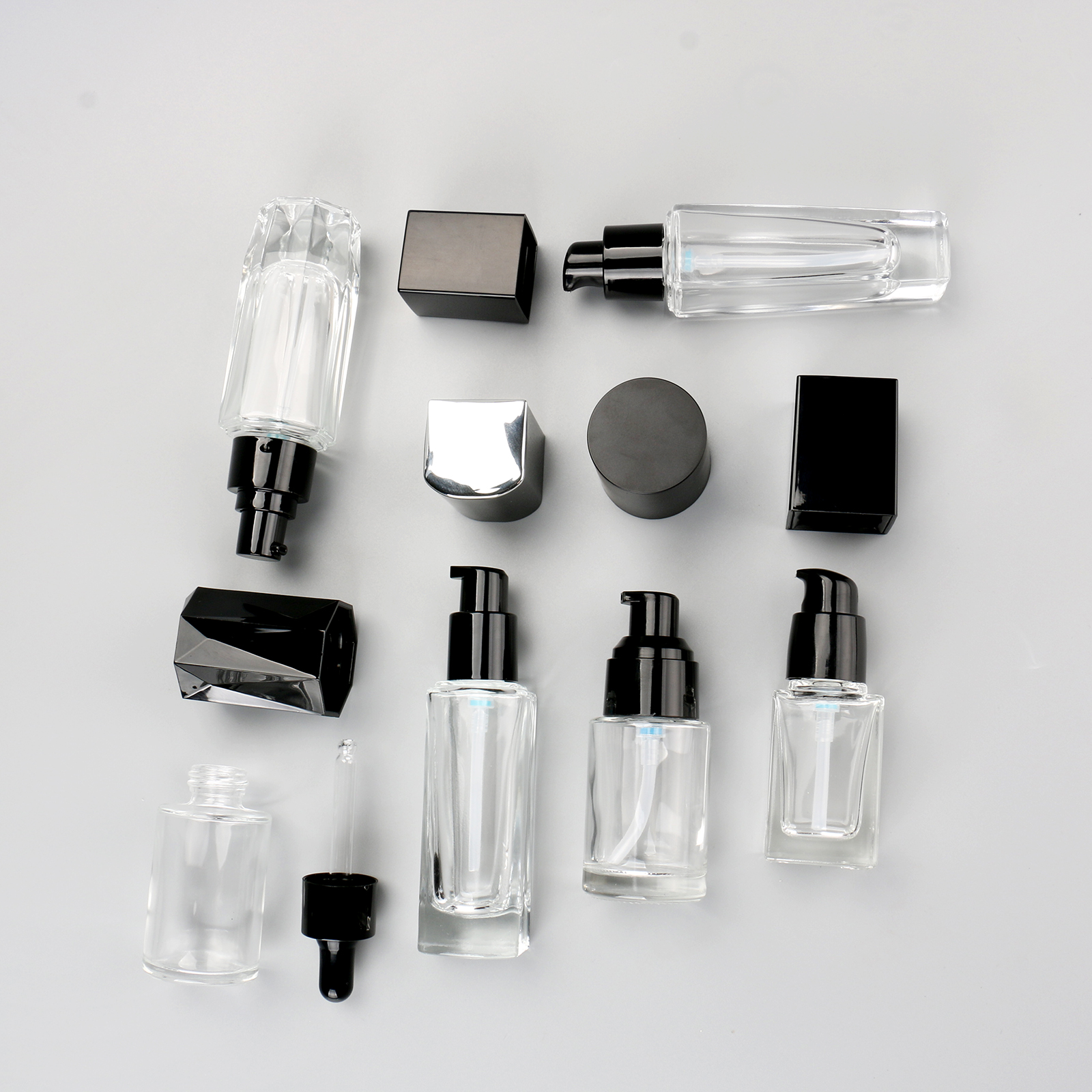 Cosmetic Packaging Container Empty Skincare Set Bottle Transparent Glass Lotion Serum Pump Bottle With Black Lid