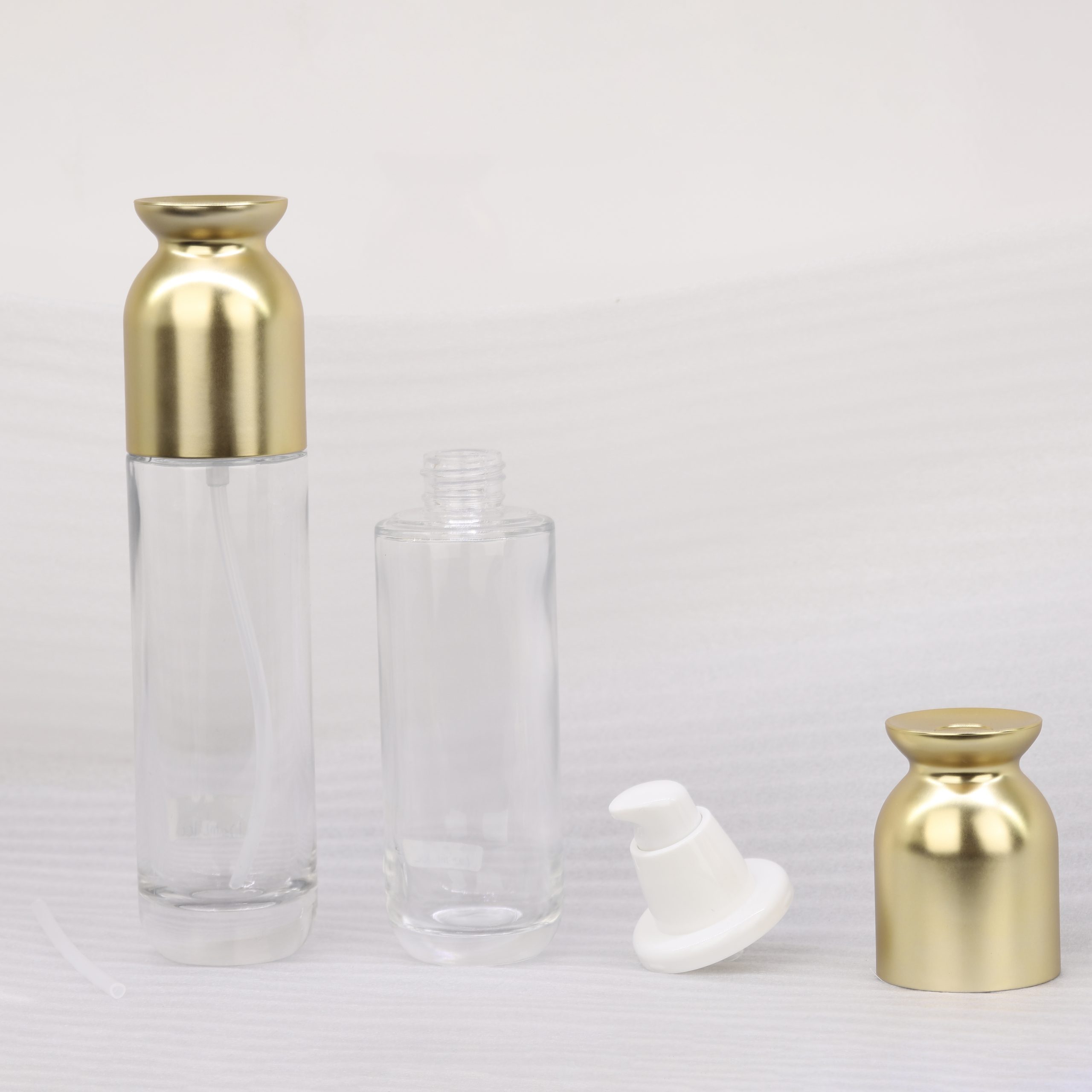 Empty Glass Skincare Packaging 100ml 120ml Clear Glass Serum Lotion Pump Bottle With Gold Cap